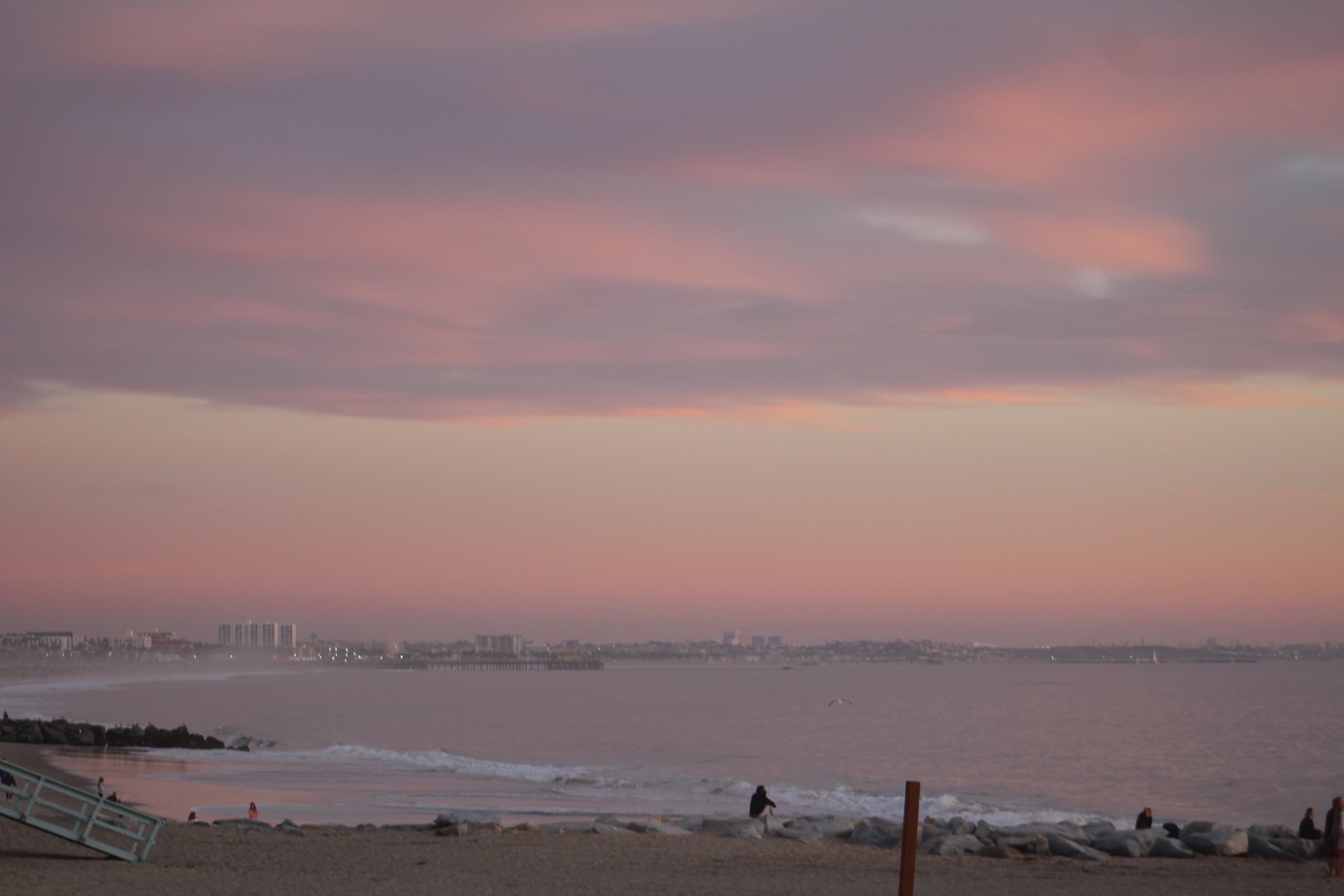 Venice Beach at sunrise, sky transitioning from purple to pink